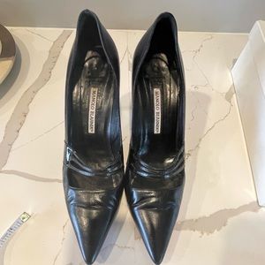 Manolo Blahnik black leather pumps.